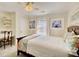 Bright bedroom features a desk, window, and floral print bedding at 1938 Kelvin Drive Dr, Lawrenceville, GA 30043