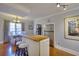 Bright eat-in kitchen features an island with butcher block countertop and seating at 1938 Kelvin Dr, Lawrenceville, GA 30043