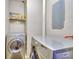 Functional laundry room is equipped with modern washing and drying machines at 1938 Kelvin Dr, Lawrenceville, GA 30043