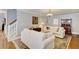 Comfortable living room with hardwood floors, white sofas, and a decorative fireplace at 1938 Kelvin Dr, Lawrenceville, GA 30043