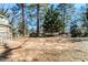 View of the backyard with mature trees at 238 Howell Sw Dr, Atlanta, GA 30331