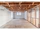 Unfinished basement space featuring exposed ceiling beams, and concrete walls at 238 Howell Sw Dr, Atlanta, GA 30331