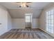 This is a bedroom with neutral walls, carpeted floors, and a door to the outside at 238 Howell Sw Dr, Atlanta, GA 30331