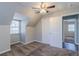 This is a bedroom with neutral walls, carpeted floors, a window and a closet at 238 Howell Sw Dr, Atlanta, GA 30331