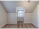 This is a bedroom with neutral walls, carpeted floors, and a window at 238 Howell Sw Dr, Atlanta, GA 30331