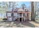 Charming brick home with a cozy front porch, dormer windows, and a unique rooftop deck at 238 Howell Sw Dr, Atlanta, GA 30331