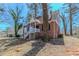 Exterior view of a classic brick home with inviting front porch and tree-lined yard at 238 Howell Sw Dr, Atlanta, GA 30331