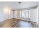 Open concept living area featuring laminate flooring, neutral colors, and bright natural light at 238 Howell Sw Dr, Atlanta, GA 30331
