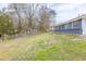 View of the backyard with green grass and a chainlink fence at 2631 Santa Barbara Nw Dr, Atlanta, GA 30318