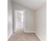 Small bedroom featuring neutral carpet, white walls, and a view to the hall at 2631 Santa Barbara Nw Dr, Atlanta, GA 30318
