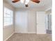 Bedroom with neutral carpeting, ceiling fan, and natural light from a window at 2631 Santa Barbara Nw Dr, Atlanta, GA 30318