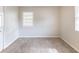 Bedroom with neutral walls and natural light from two windows at 2631 Santa Barbara Nw Dr, Atlanta, GA 30318