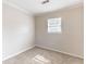 Cozy bedroom with carpet, neutral walls and natural light from a window at 2631 Santa Barbara Nw Dr, Atlanta, GA 30318