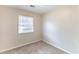 Cozy bedroom with carpet, neutral walls and natural light from a window at 2631 Santa Barbara Nw Dr, Atlanta, GA 30318