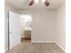 Comfortable bedroom with ensuite bathroom, carpet flooring, ceiling fan and natural light from the window at 2631 Santa Barbara Nw Dr, Atlanta, GA 30318