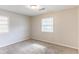 Bedroom featuring two windows allowing for abundant natural light at 2631 Santa Barbara Nw Dr, Atlanta, GA 30318