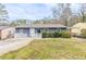 Charming one-story home with a manicured lawn, complemented by a welcoming entryway and a cozy front porch at 2631 Santa Barbara Nw Dr, Atlanta, GA 30318