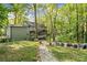 Relaxing backyard with a stone pathway, fire pit and comfortable outdoor seating area at 275 Waverly W Trce, Roswell, GA 30075