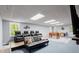 Finished basement with a foosball table, wall-mounted TV, and comfortable seating at 275 Waverly W Trce, Roswell, GA 30075