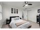 Bedroom with a bed, closet, minimalist artwork, and a ceiling fan at 275 Waverly W Trce, Roswell, GA 30075