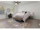 Bedroom with a round mirror, a desk, a bed, and a bench in the center of the room at 275 Waverly W Trce, Roswell, GA 30075
