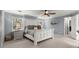 This is a spacious bedroom with neutral colored walls and a white farmhouse style bed at 275 Waverly W Trce, Roswell, GA 30075