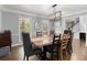 Bright dining room featuring modern lighting and ample seating for gatherings at 275 Waverly W Trce, Roswell, GA 30075
