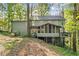 Charming two-story home with a screened porch and deck nestled in a wooded lot at 275 Waverly W Trce, Roswell, GA 30075