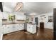 Charming kitchen featuring classic white cabinets, granite counters, and modern appliances at 275 Waverly W Trce, Roswell, GA 30075