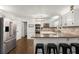 Modern kitchen with stainless steel appliances, granite countertops, and a breakfast bar at 275 Waverly W Trce, Roswell, GA 30075
