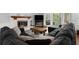 Comfortable living room featuring a fireplace and sliding glass doors to the exterior at 275 Waverly W Trce, Roswell, GA 30075
