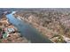Aerial view of a winding river, neighborhood, and a swimming pool at 312 River Glen Dr, Roswell, GA 30075