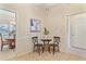 Charming dining area with neutral decor, wainscoting, a small table and convenient access to other rooms at 312 River Glen Dr, Roswell, GA 30075