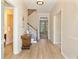 Inviting entryway with hardwood floors, staircase, and views to the front door at 312 River Glen Dr, Roswell, GA 30075