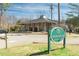 Exterior view of the River Landing building with a community sign at 312 River Glen Dr, Roswell, GA 30075