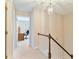 Upstairs hallway with hardwood trim and views to an office space at 312 River Glen Dr, Roswell, GA 30075
