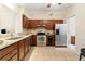 Well-equipped kitchen featuring stainless steel appliances, granite countertops, and ample cabinet space, seamlessly blending style at 312 River Glen Dr, Roswell, GA 30075