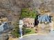 An aerial view showcases the property's extensive grounds and proximity to serene, wooded areas at 1043 Sugar Pike Way, Canton, GA 30115