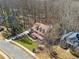An aerial view highlights the home's location on a well-manicured lot at 1043 Sugar Pike Way, Canton, GA 30115
