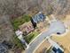 An aerial shot reveals a spacious lot with lush greenery in a quiet, Gathering-friendly neighborhood at 1043 Sugar Pike Way, Canton, GA 30115