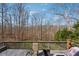 Spacious back deck overlooks peaceful, wooded scenery with plenty of room to relax at 1043 Sugar Pike Way, Canton, GA 30115