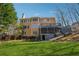 A spacious backyard features a multi-level deck and patio, perfect for outdoor entertaining at 1043 Sugar Pike Way, Canton, GA 30115