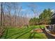 Beautiful view of the backyard and trees from the home's property, perfect for outdoor activities at 1043 Sugar Pike Way, Canton, GA 30115