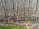 View of a wooden fence bordering the yard, offering privacy and defining the outdoor space at 1043 Sugar Pike Way, Canton, GA 30115