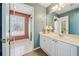 Stylish bathroom featuring a single sink vanity, and a glass-enclosed shower offering a spa-like experience at 1043 Sugar Pike Way, Canton, GA 30115