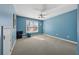 Bright bedroom featuring a ceiling fan and a window, perfect for creating a cozy and relaxing atmosphere at 1043 Sugar Pike Way, Canton, GA 30115