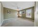 Neutral-toned bedroom featuring three windows that fill the space with natural light and a ceiling fan at 1043 Sugar Pike Way, Canton, GA 30115