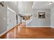 Inviting foyer with hardwood floors, a grand staircase, and a view into the dining room at 1043 Sugar Pike Way, Canton, GA 30115