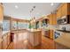 Well-equipped kitchen featuring stainless appliances, an island, and an adjoining breakfast area at 1043 Sugar Pike Way, Canton, GA 30115