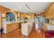 Bright kitchen with stainless steel appliances, tiled backsplash, and a central island at 1043 Sugar Pike Way, Canton, GA 30115
